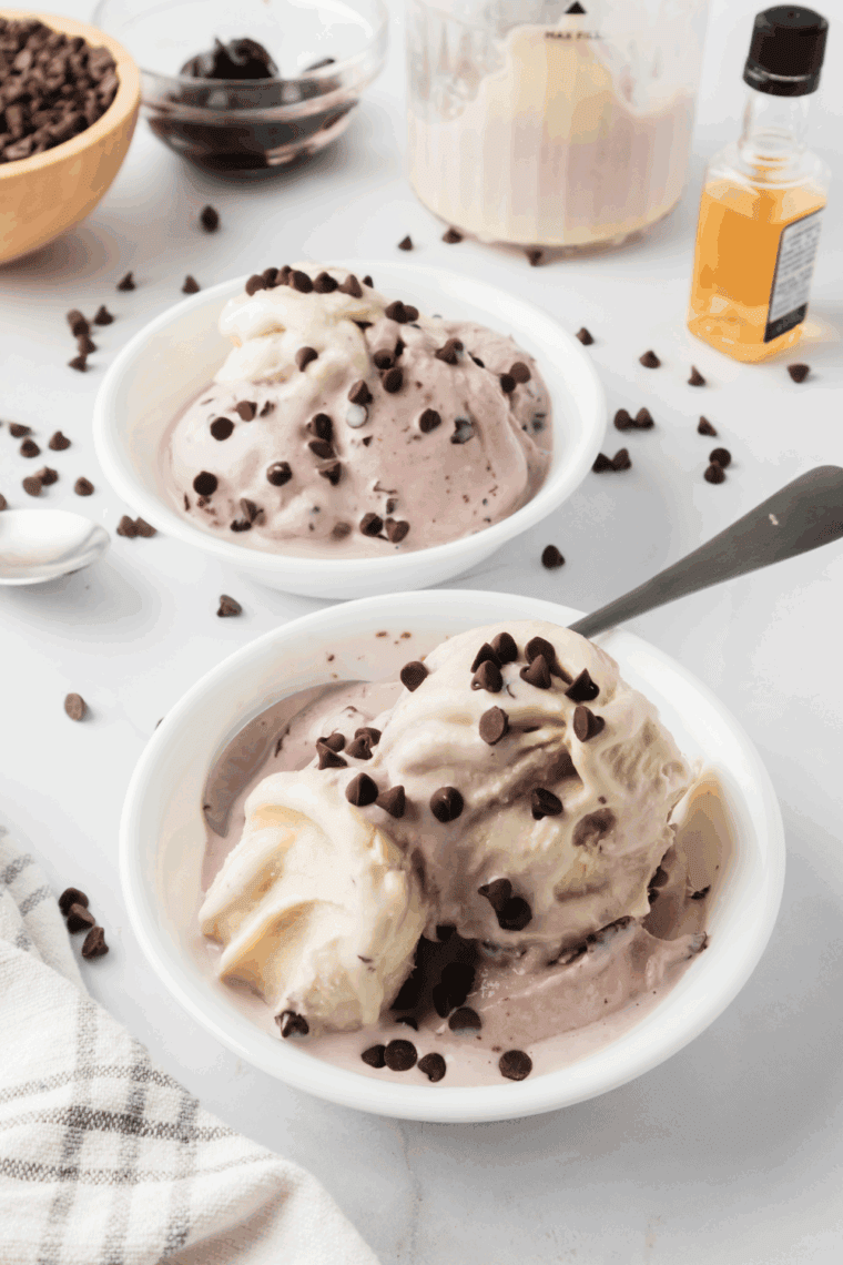 Bowl of Ninja Creami Cherry Garcia ice cream with cherries and chocolate fudge pieces.