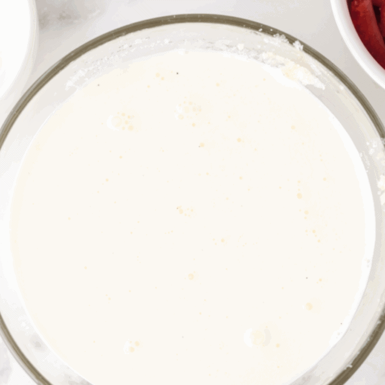 Whisking coconut milk, brewed coffee, sugar, and vanilla together in a bowl for Ninja Creami non-dairy Jamoca chip ice cream base