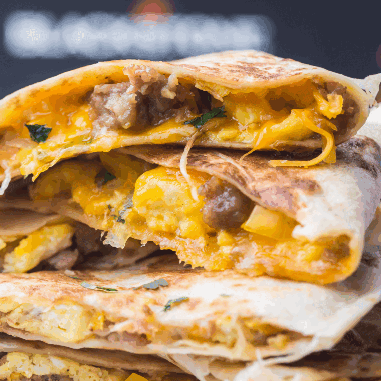 Taco Bell copycat breakfast quesadilla with scrambled eggs, melted cheese, and breakfast meat, served on a plate.