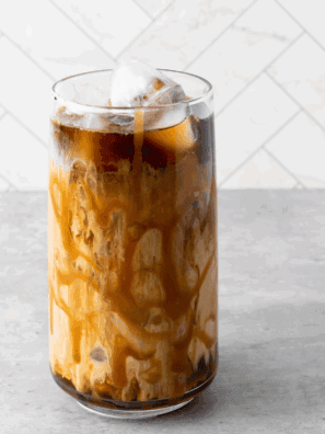 Homemade Tim Hortons iced coffee served over ice in a glass.