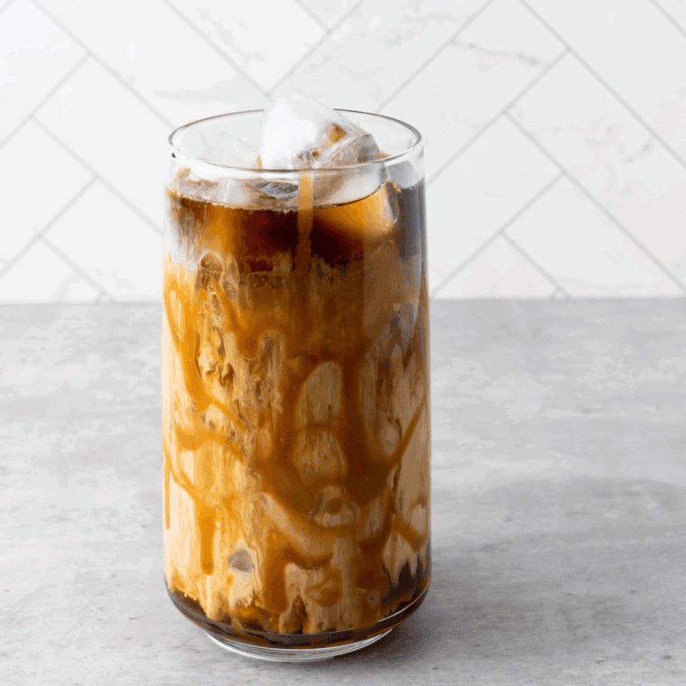 Homemade Tim Hortons iced coffee served over ice in a glass.