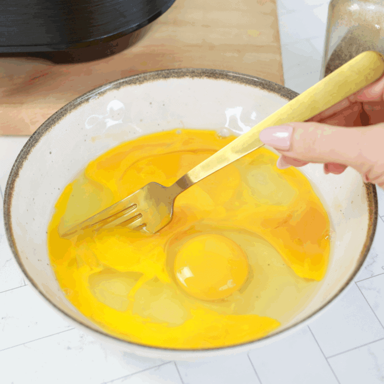 In a large mixing bowl, whisk the eggs with a fork, until yolks are broken.