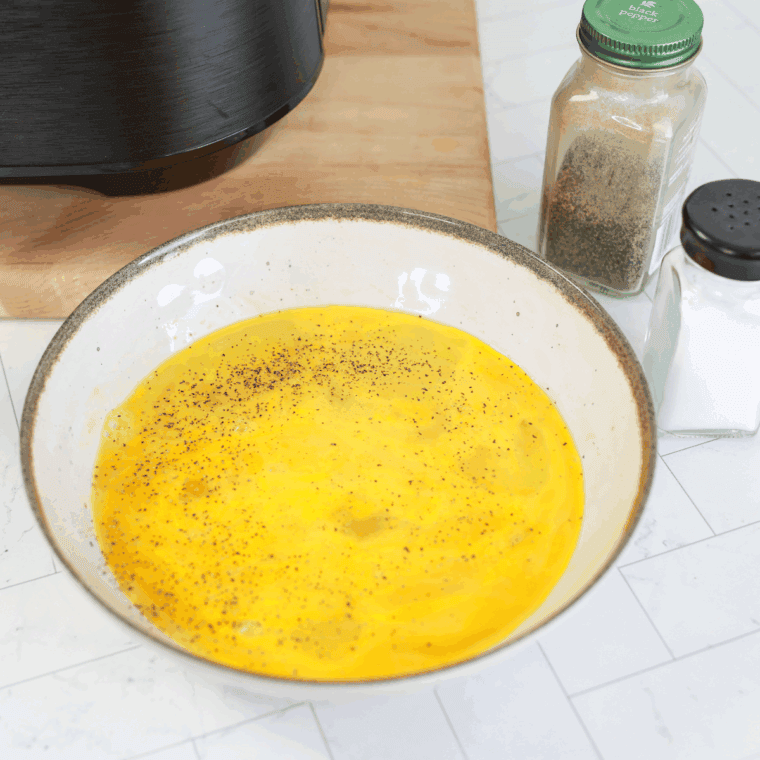 Adding the spices to the scrambled egg mixture.
