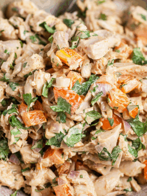Bowl of creamy Waldorf-Astoria Thousand Island dressing with a spoon, ready to serve on salads or sandwiches.