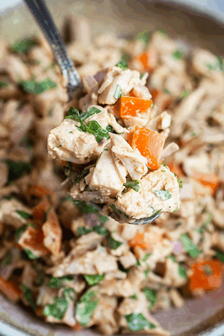 Creamy Waldorf-Astoria Thousand Island dressing in a bowl with a spoon, ready to serve over salads or sandwiches.