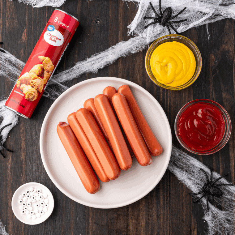 Ingredients needed for Air Fryer Spider Hot Dogs on kitchen table.