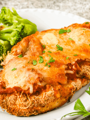 Barefoot Contessa Chicken Parmesan recipe with crispy breaded chicken topped with marinara sauce and melted mozzarella.