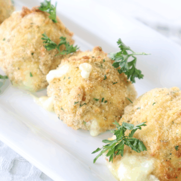 Golden, crispy jalapeño cheese bites served on a plate, ready to enjoy.