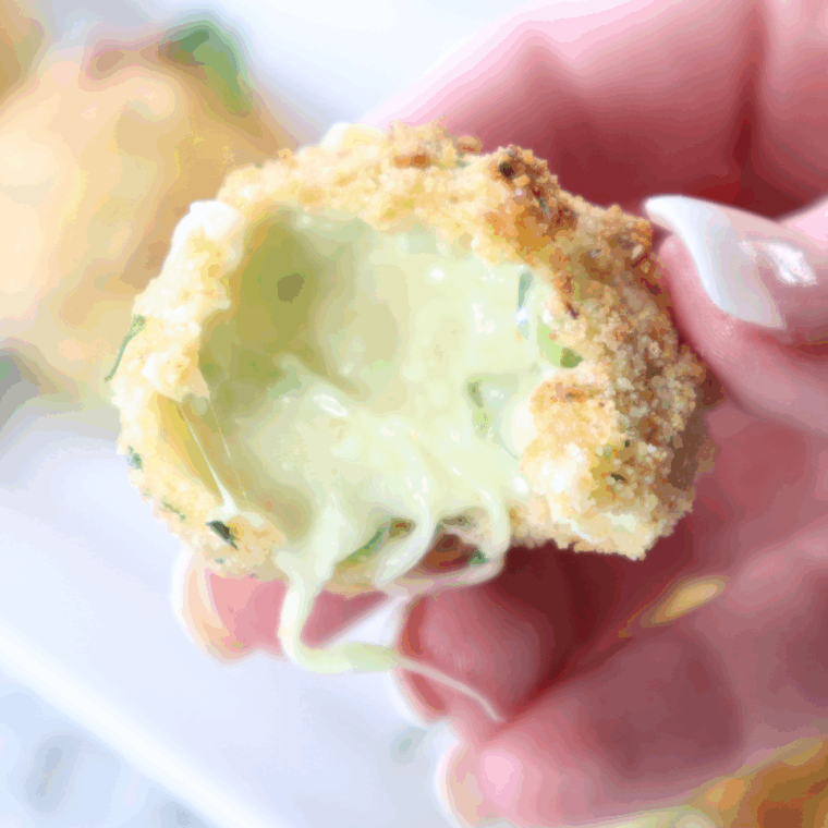 Golden, crispy jalapeño cheese bites arranged on a plate, ready to serve.