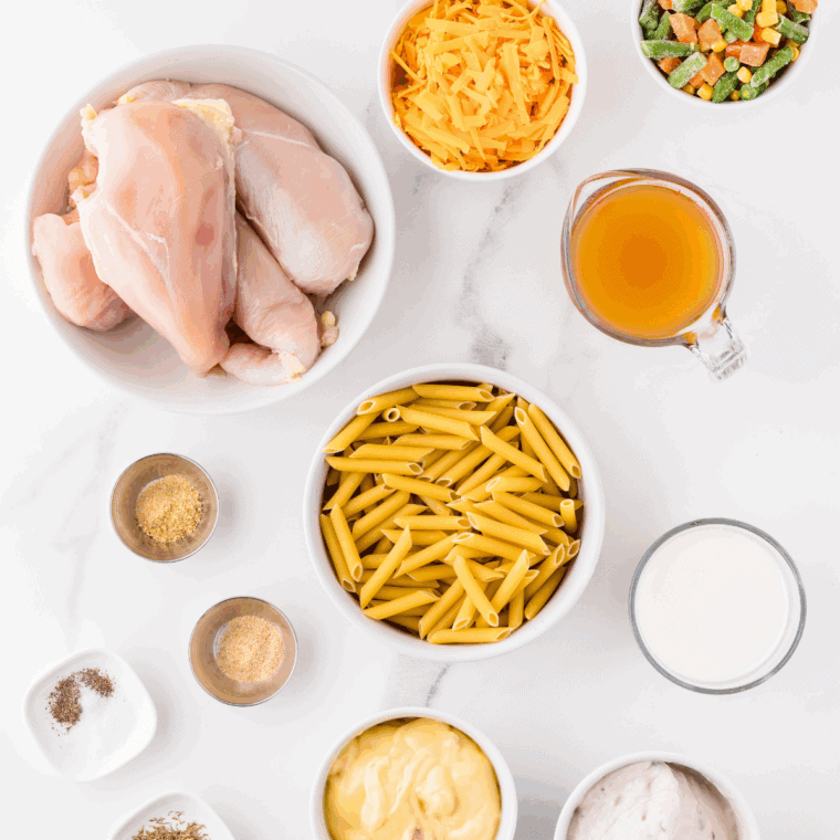 Ingredients needed for Crock Pot Chicken Pot Pie Pasta on kitchen table.