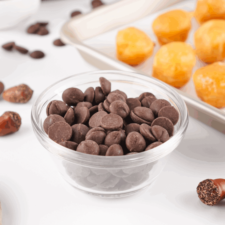 Chocolate chips melting in a small microwave-safe bowl, stirred until smooth.