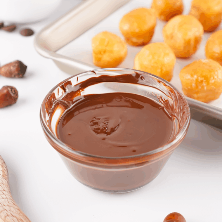 Chocolate chips melted in a small microwave-safe bowl.