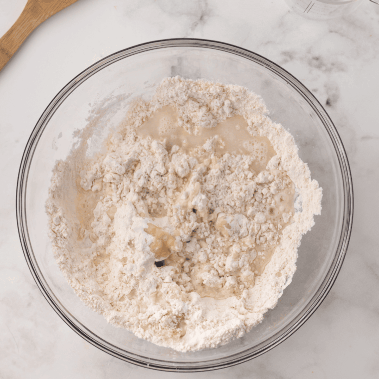Combine flour, baking powder, salt, oil and warm water in a large bowl to form a soft dough.