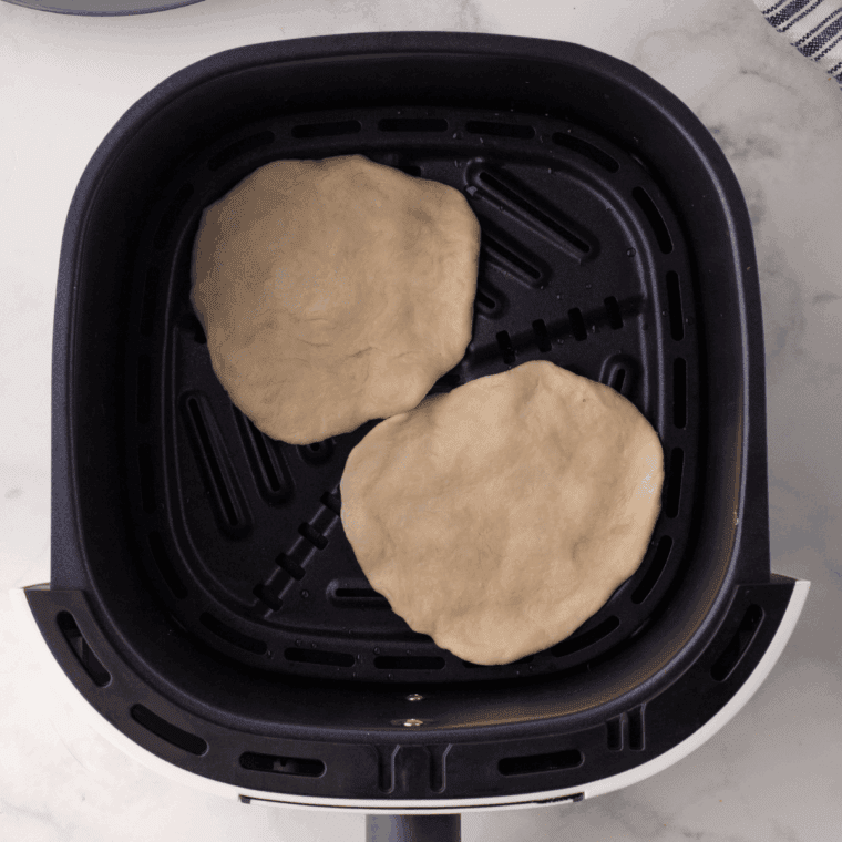 Stack the freshly cooked tortillas and cover with a towel to keep them warm and soft.