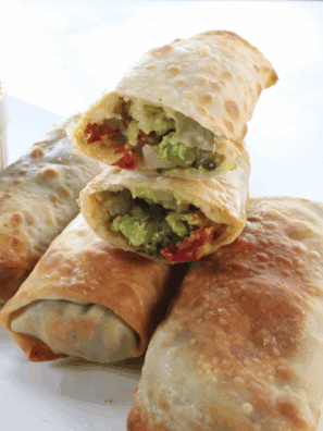 Make BJ’s Avocado Egg Rolls at home! Crispy egg rolls stuffed with creamy avocado, sun-dried tomatoes, and red onion, served with a tangy cilantro-lime dipping sauce.