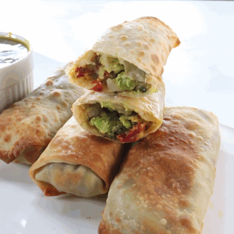 Crispy homemade BJ’s Avocado Egg Rolls served with creamy cilantro-lime dipping sauce.