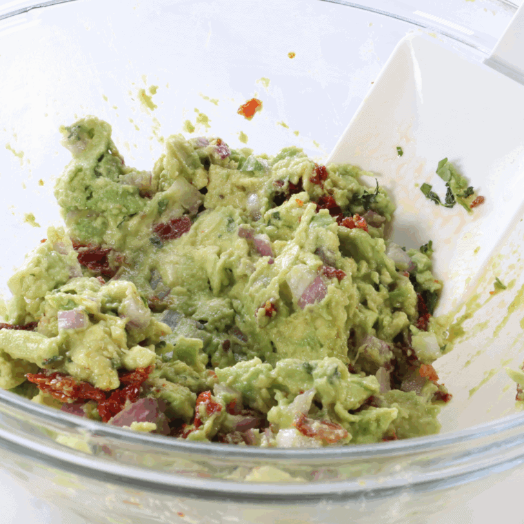In a medium bowl, combine diced avocado, sun-dried tomatoes, red onion, cilantro, lime juice, salt, and pepper and mix lightly.