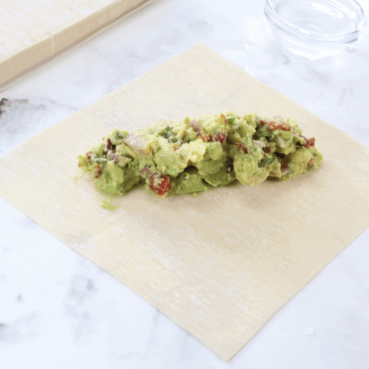 Place the egg rolls brushed with oil in a single layer into the basket of the air fryer, flip over halfway through, until golden and crispy.