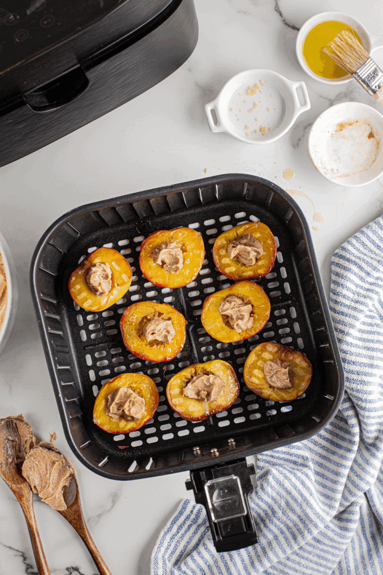 A bowl of smooth brown sugar cinnamon cream cheese, ready to spread with a spoon.