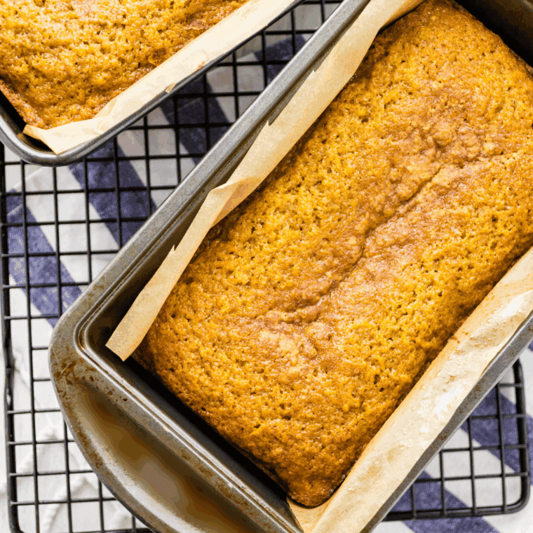 Pouring cardamom pumpkin bread batter into a loaf pan, baking until golden brown, and cooling on a wire rack before slicing and serving.
