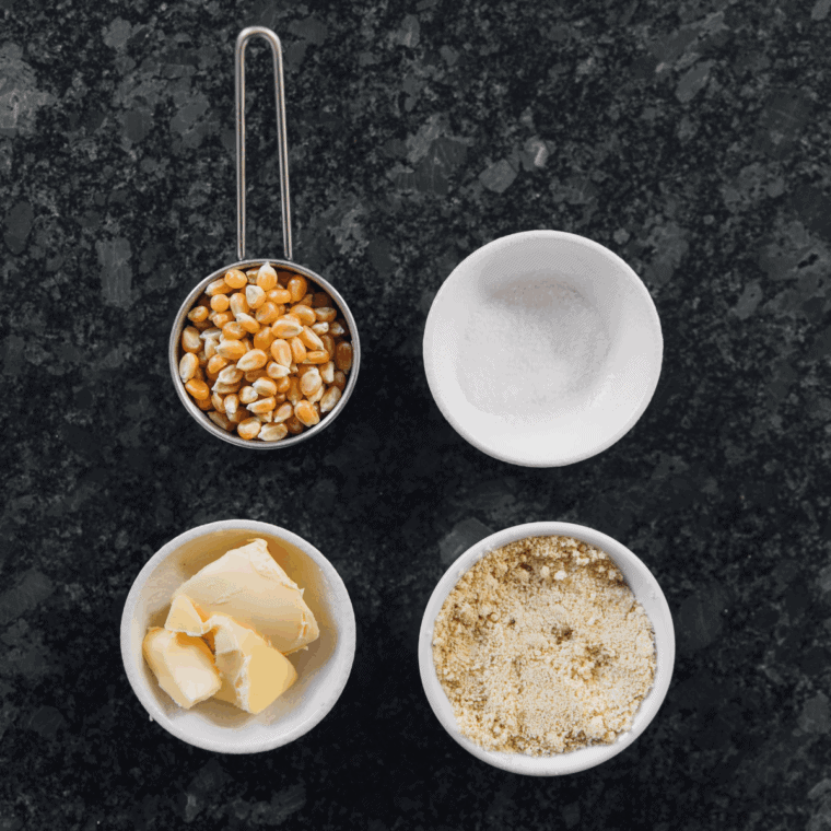 Ingredients needed for Easy Cast Iron Popcorn on kitchen table.