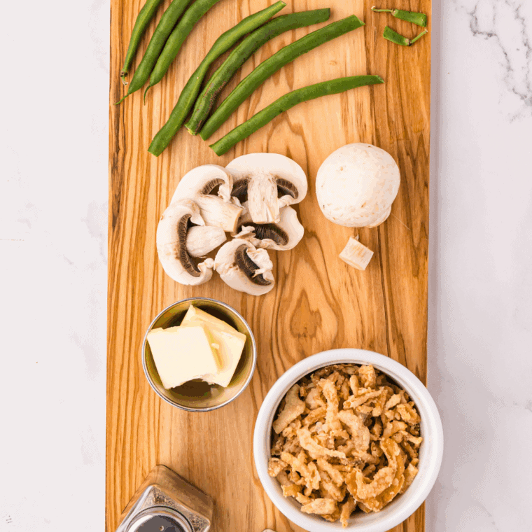 Ingredients needed for Easy Cast Iron Skillet Green Beans on kitchen table.