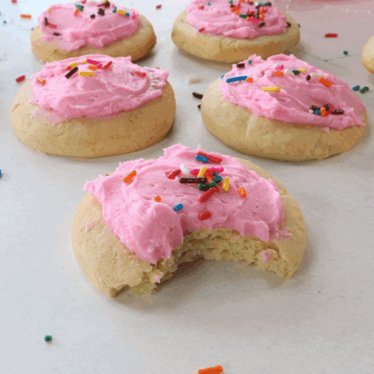 Easy Copycat Crumbl Sugar Cookies topped with pink frosting, ready to serve.