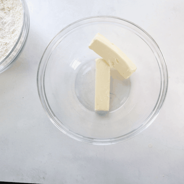 Creaming butter and sugar together in a mixing bowl until light and fluffy.