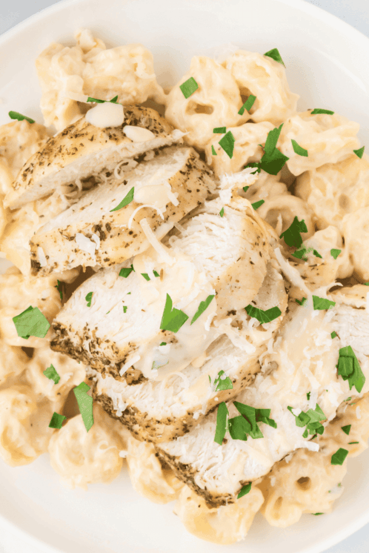 Homemade Fazoli’s Alfredo Sauce in a bowl, creamy, cheesy, and ready to serve over pasta or chicken.