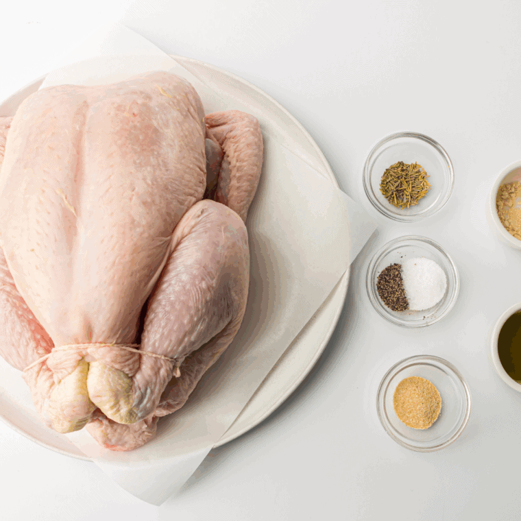 Ingredients needed for Easy Ina Garten Perfect Roast Chicken on kitchen table.