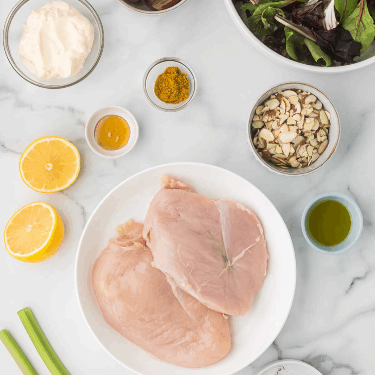 Ingredients needed for Easy Ina Garten's Curried Chicken Salad Recipe on kitchen table.