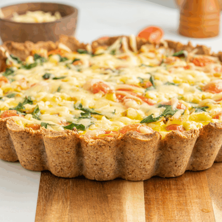 Golden-baked Ina Garten quiche with cheesy, creamy filling and fresh herbs.