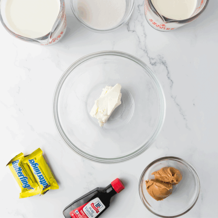 Ingredients needed for Easy Ninja Creami Butterfinger Ice Cream on kitchen table.