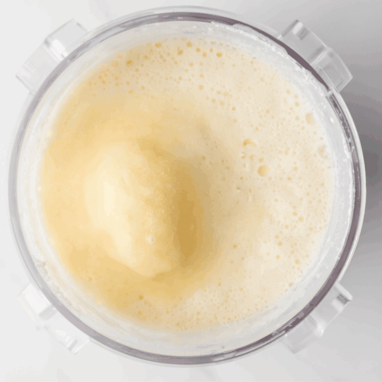 Mixing whole milk, instant butterscotch pudding, peanut butter, and heavy cream in a bowl until smooth.