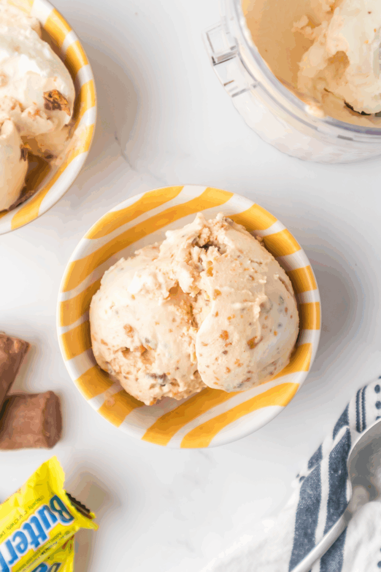 Homemade Ninja Creami Butterfinger Ice Cream served in a bowl, creamy and topped with Butterfinger pieces.