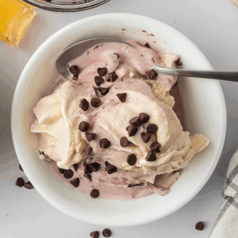 Indulge in creamy Ninja Creami Cherry Chocolate Ice Cream! Sweet cherries and chocolate chunks make this easy, homemade frozen treat irresistible.