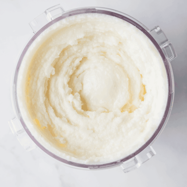 Pint container with lid on, placed in the freezer, mixture solidifying.