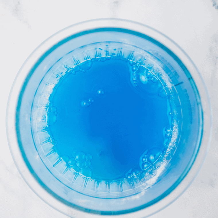Make a refreshing Blue Raspberry Slush at home with your Ninja Slushi! Quick, easy, and icy, this fruity treat is perfect for summer or any time you need a cool drink