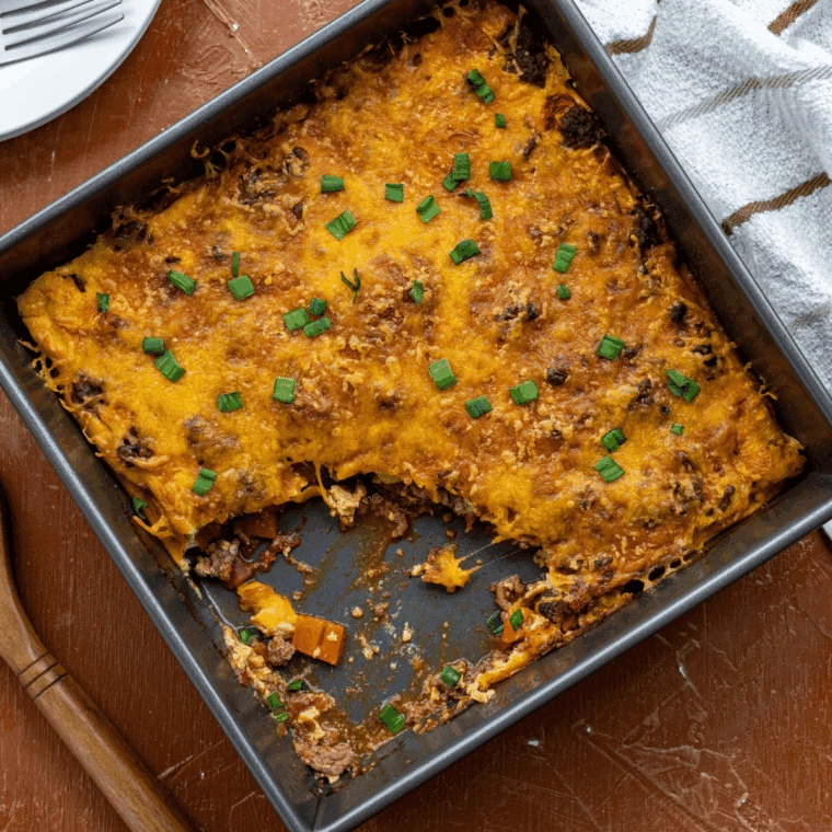 Homemade Pioneer Woman’s Cheeseburger Pie with golden crust and melted cheddar cheese on top.