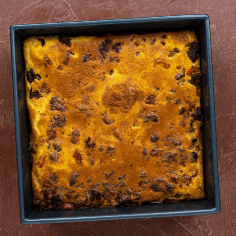 Golden-brown Pioneer Woman’s Cheeseburger Pie with melted cheese and savory beef filling on a plate.