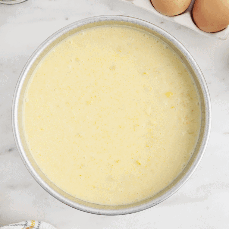 Pour corn mixture into prepared baking dish and smooth top evenly.