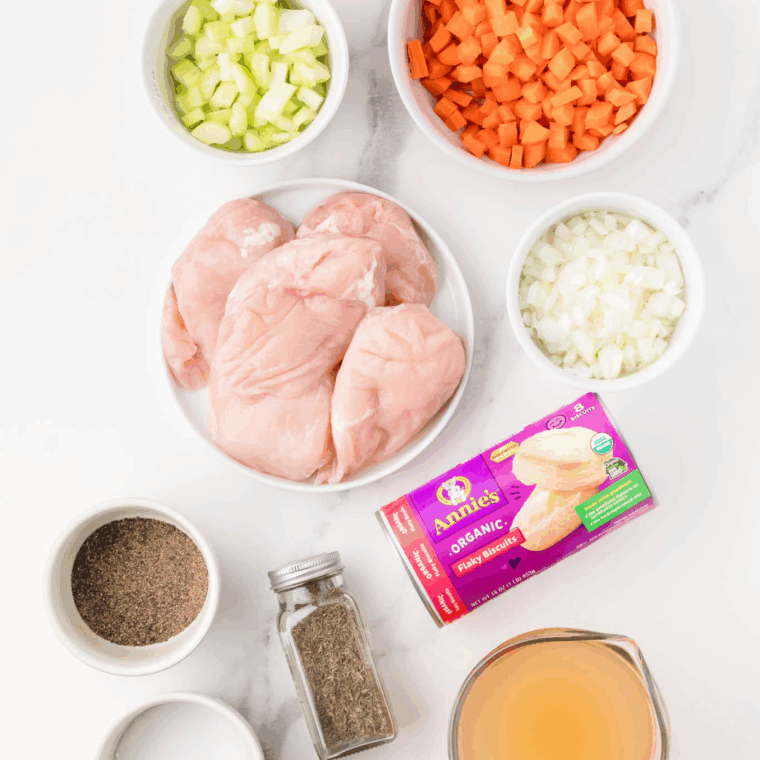 Ingredients needed for Easy Slow Cooker Chicken and Dumplings Recipe on kitchen table.