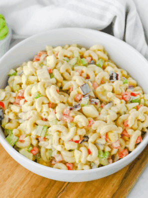 Bowl of Gordon Ramsay macaroni salad with colorful vegetables and creamy dressing.
