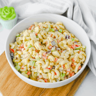 Bowl of Gordon Ramsay macaroni salad with colorful vegetables and creamy dressing.
