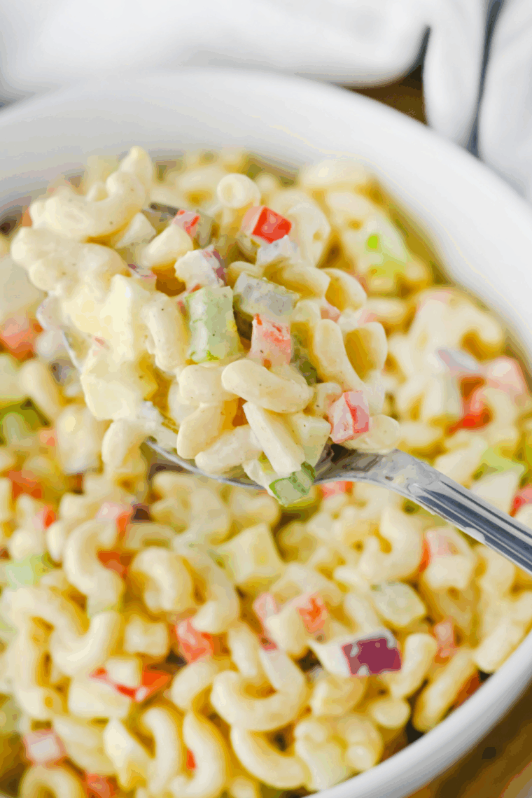 Bowl of Gordon Ramsay macaroni salad with colorful vegetables and creamy dressing.