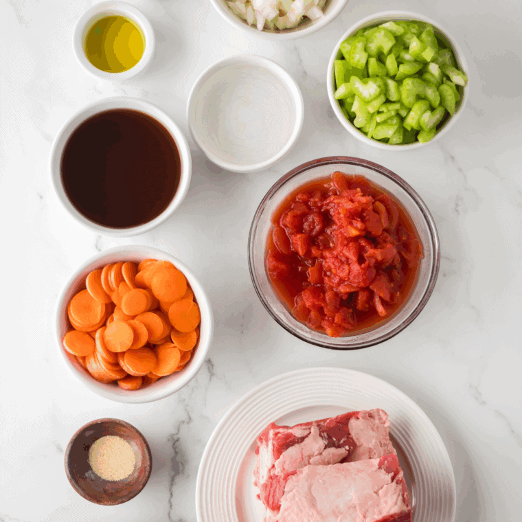 Ingredients needed for Ina Garten Osso Buco Recipe on kitchen table.