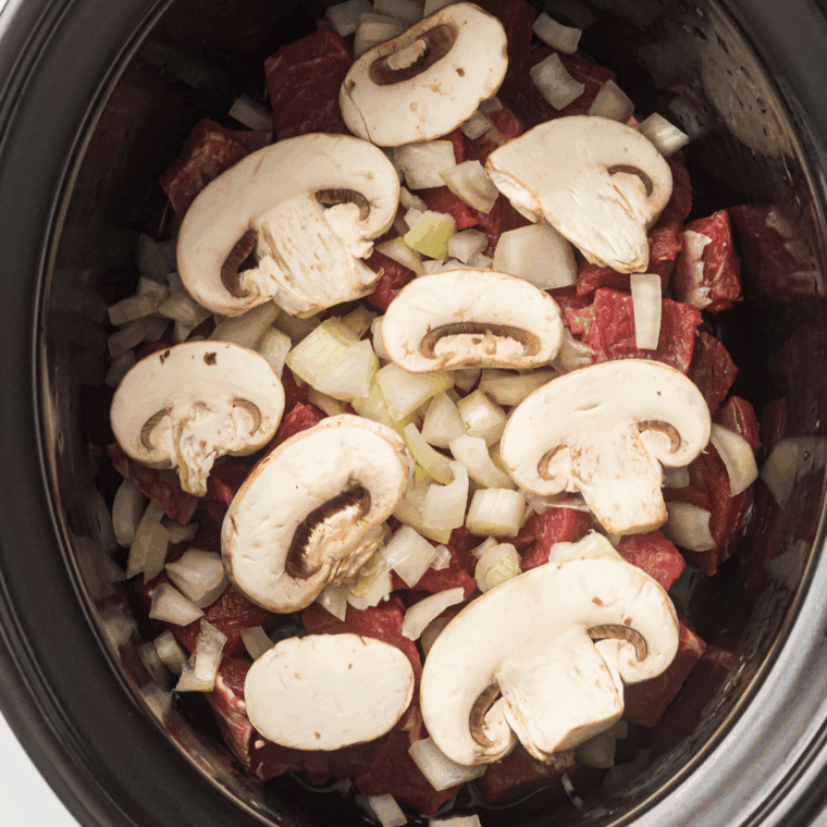 Sautéing chopped onions and sliced mushrooms in the same skillet.