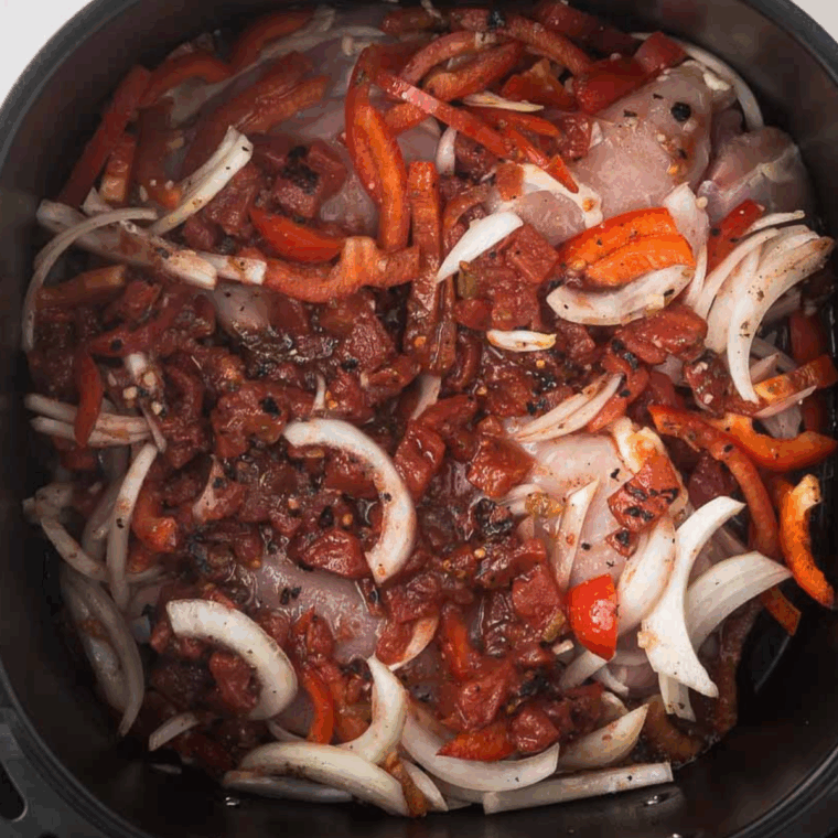 Tomato paste, crushed tomatoes, white wine, and chicken broth simmering together to create rich sauce.