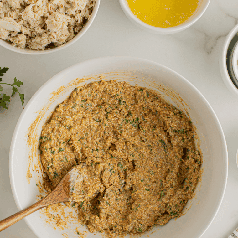 Crab mixture shaped into patties and coated with extra panko breadcrumbs for a golden, crispy exterior.