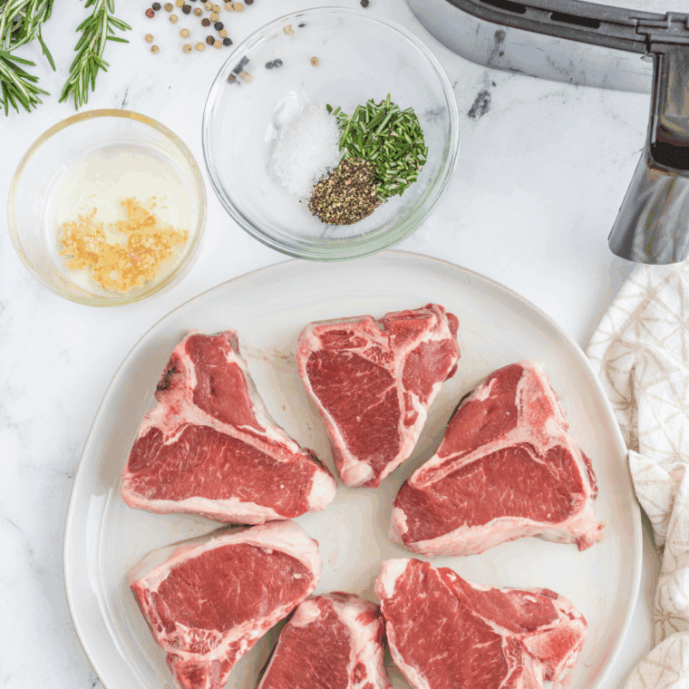 Ingredients needed for Ina Garten's Moroccan Grilled Lamb Chops Recipe on kitchen table.